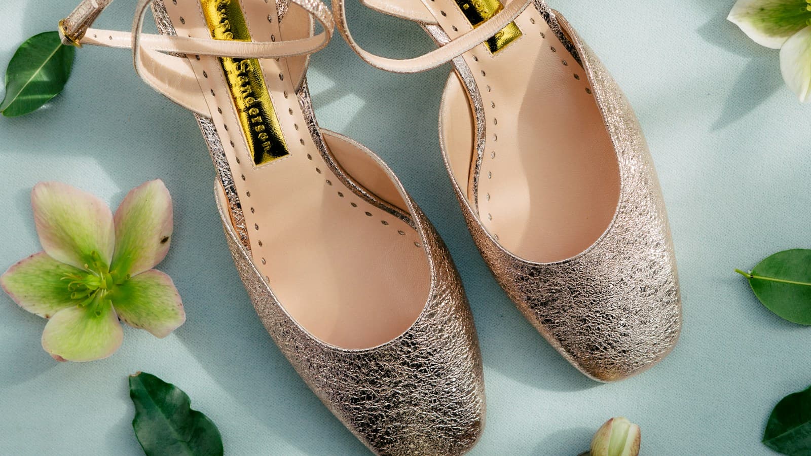 pair of yellow leather ankle-strap sandals