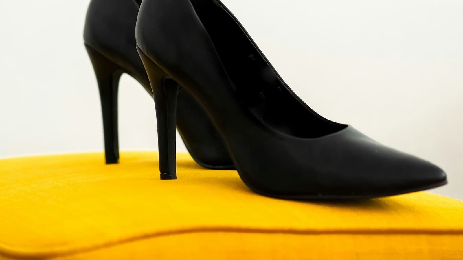 black leather peep toe heeled shoes