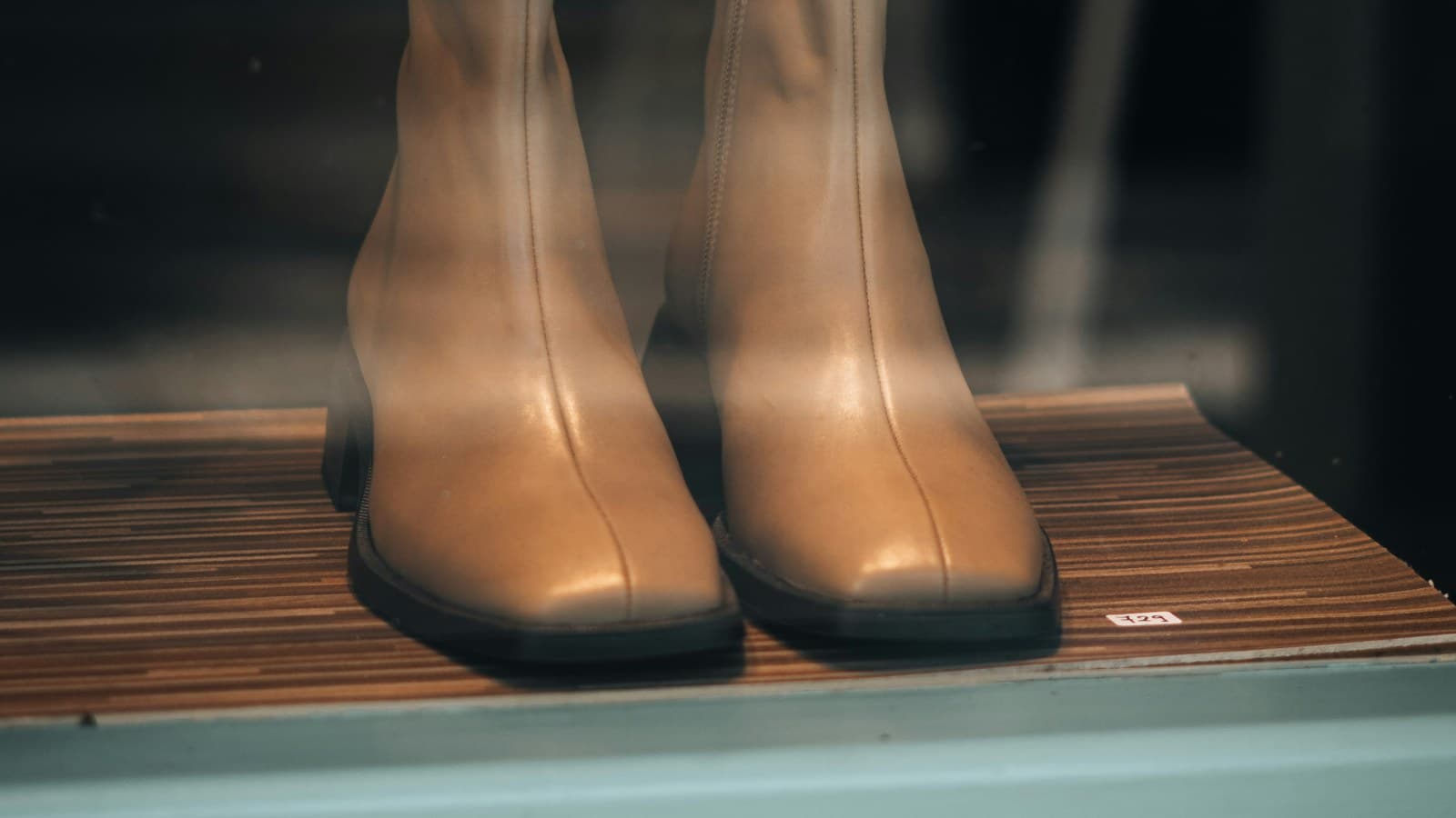 a pair of boots on a shelf