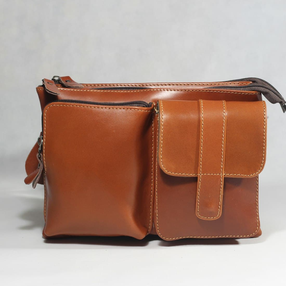 a brown leather purse