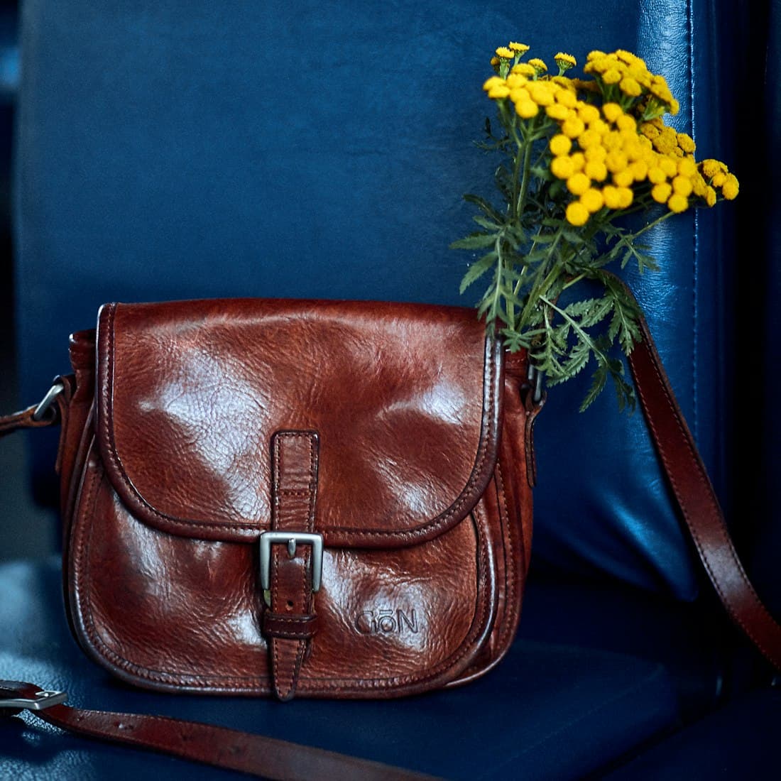 a purse with a flower in it