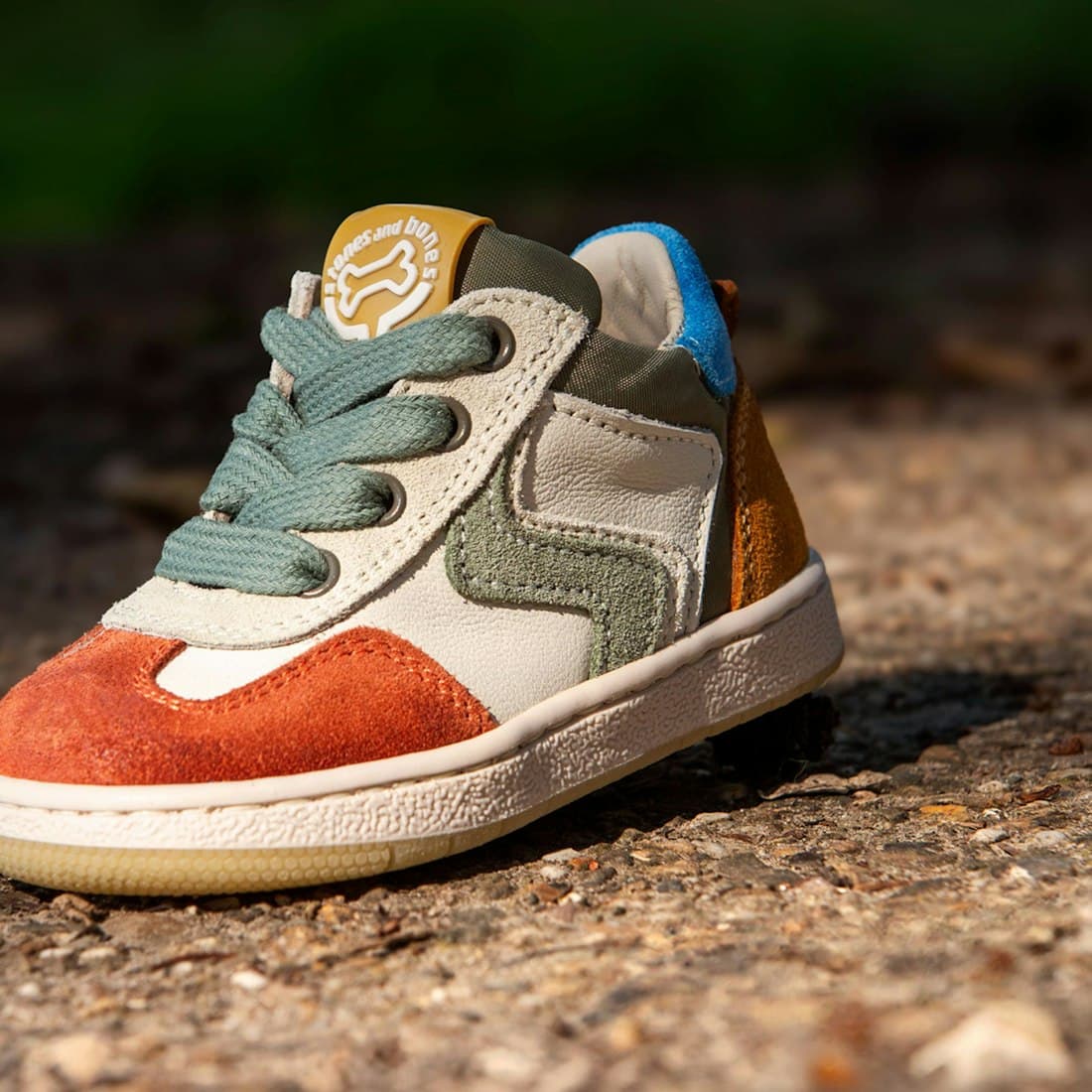 A colorful sneaker is displayed outdoors