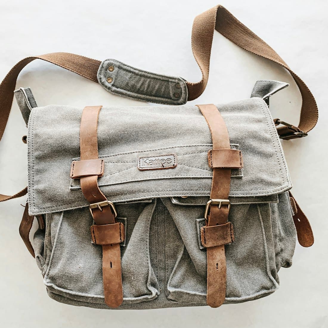 gray and brown messenger bag