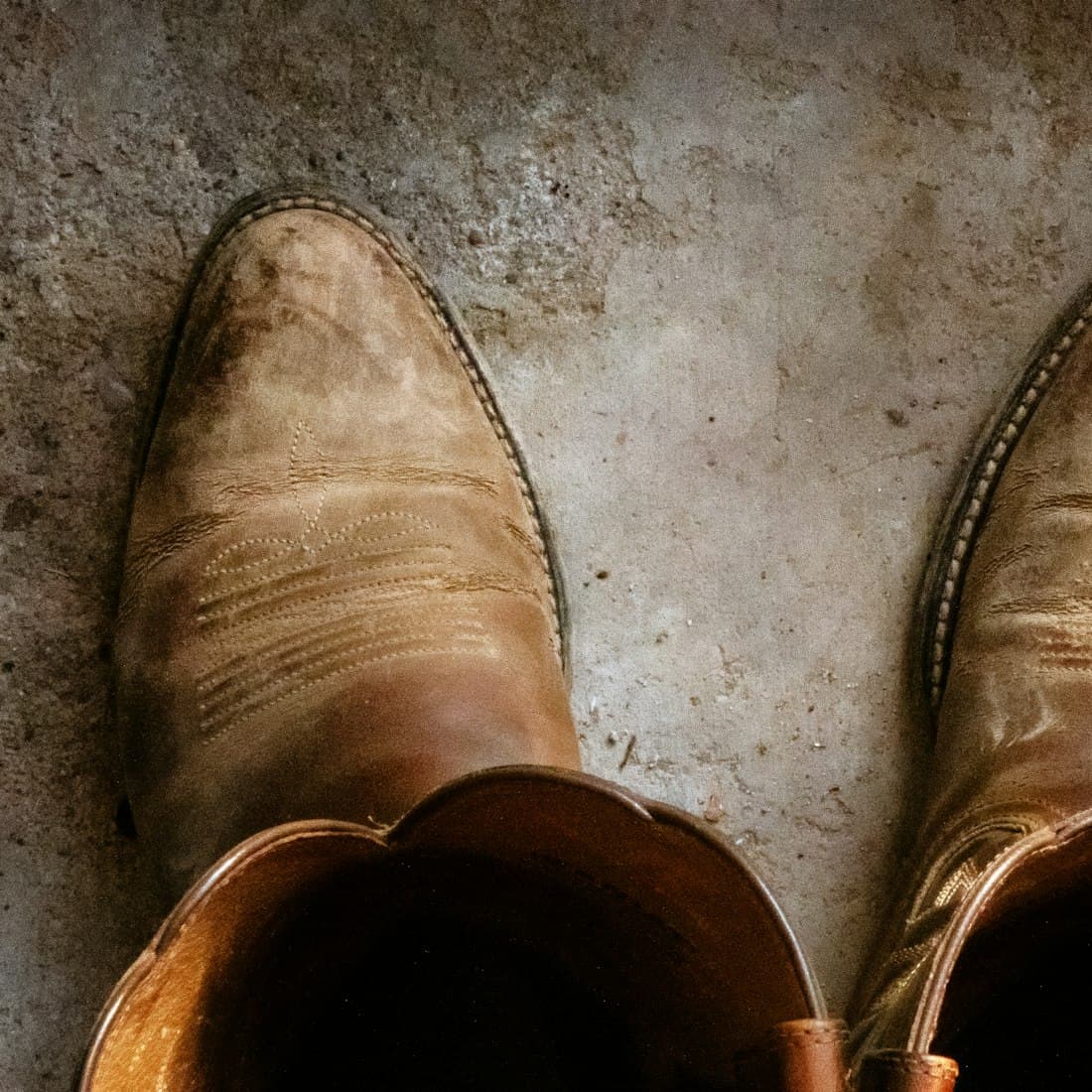 pair of brown leather cowboy boots