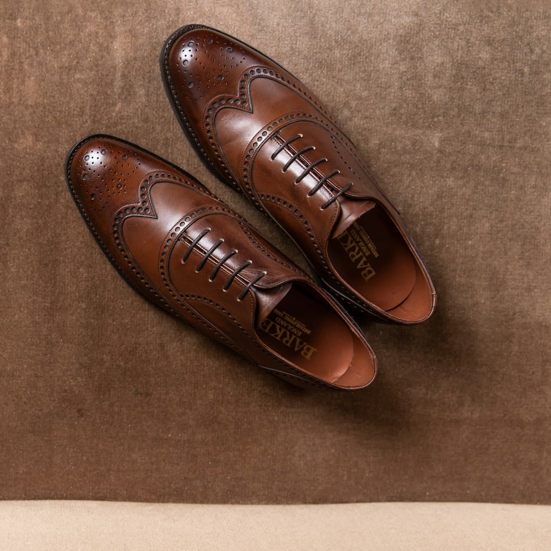 brown leather shoes on brown floor tiles