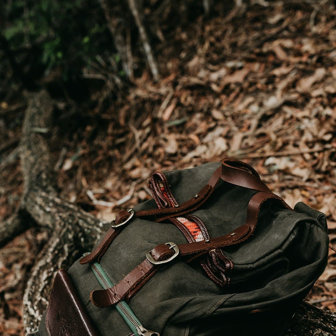 black and brown leather backpack