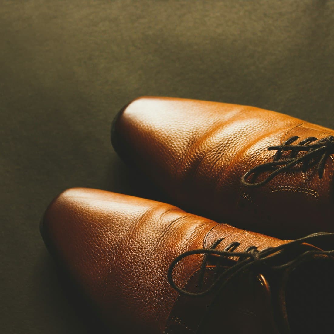 pair of brown leather dress shoes