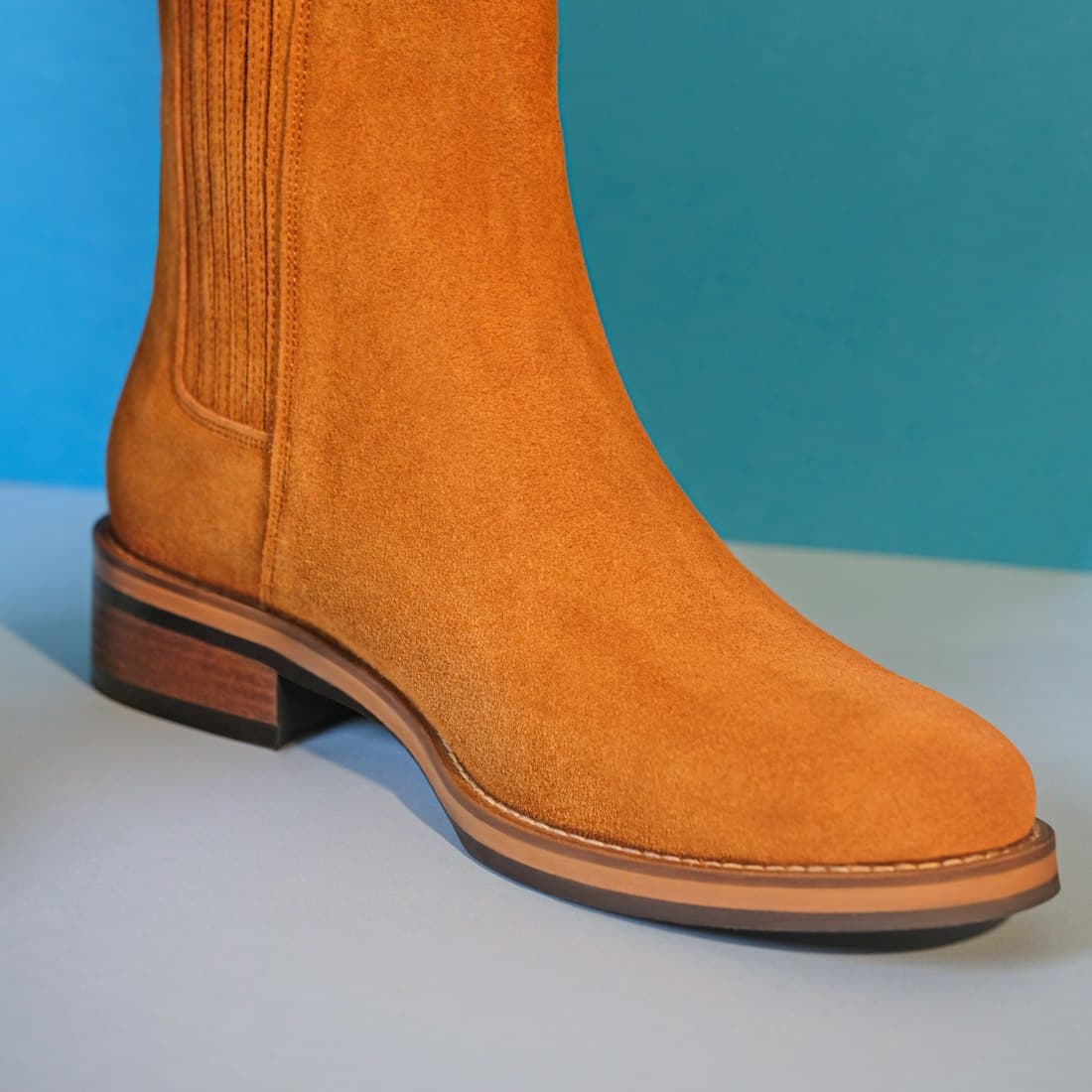 a close up of a person wearing a pair of boots
